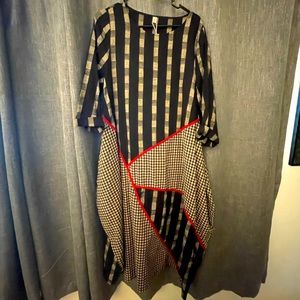 Fit and flare artsy dress with pockets.
